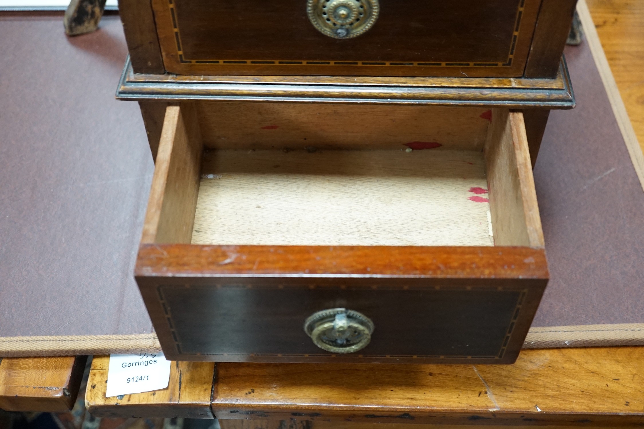 An Edwardian ebonised jardiniere stand with brass liner, width 46cm, depth 46cm, height 85cm, and a miniature two drawer chest *Please note the sale commences at 9am.